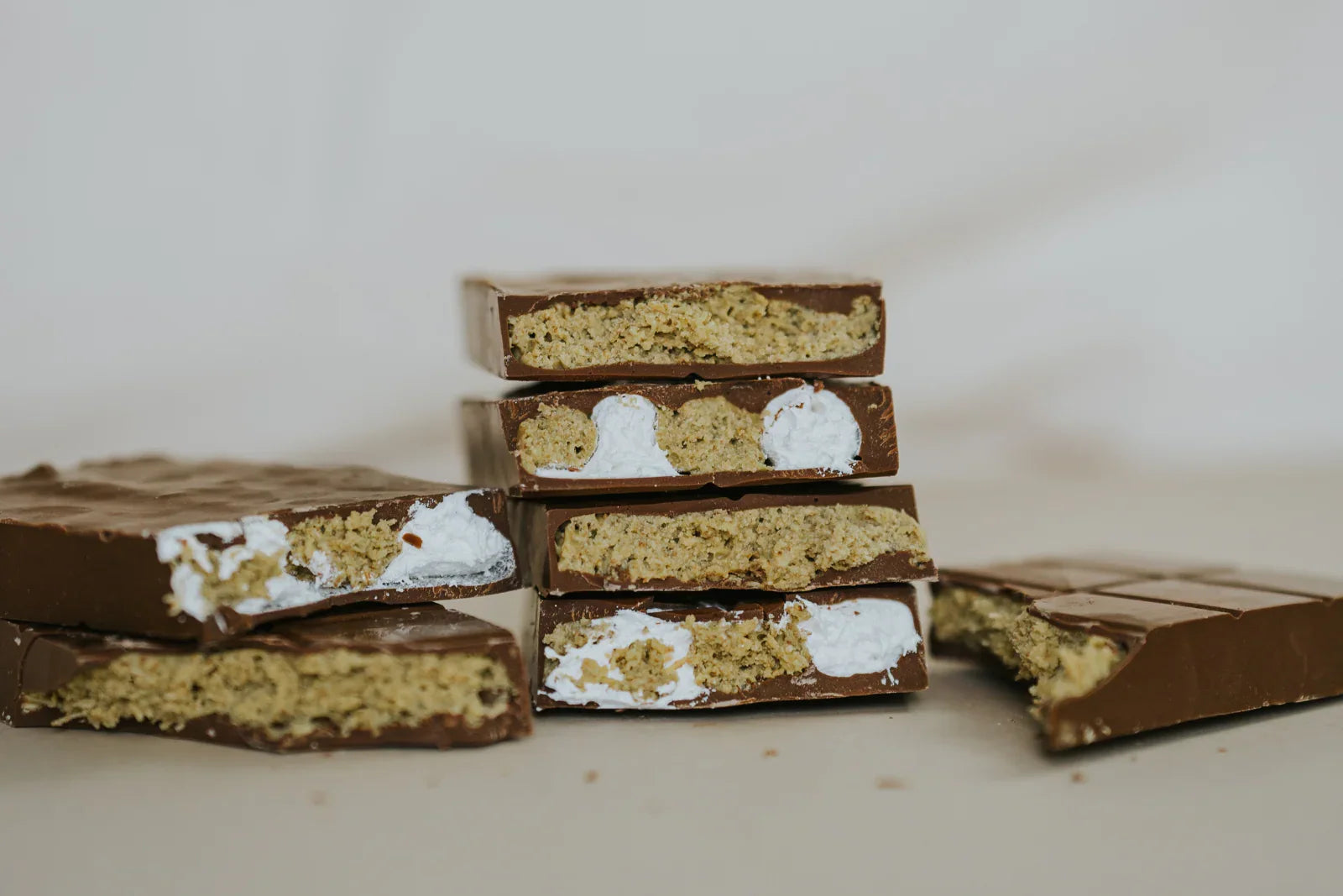 stacks of dubai pistachio chocolate bars with and without marshmallow fluff
